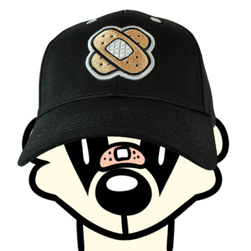 Front view of the Friends Embroidered Cap, worn by a badger character. The cap showcases an embroidered bandage graphic on the front, symbolising the playful and fun design of the streetwear brand.